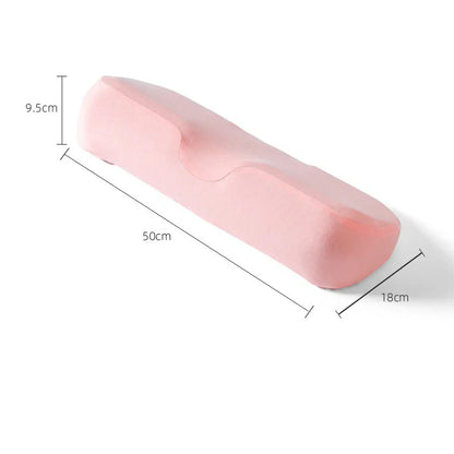 Pink memory foam cervical pillow with ergonomic contour design for neck support, 50x18x9.5 cm size