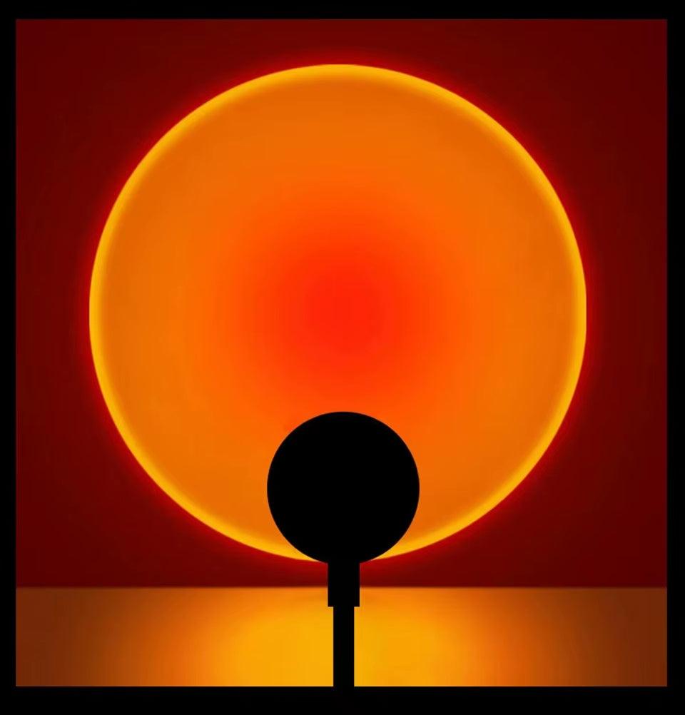 LED Sunset Lamp projecting warm orange sunset glow on wall with USB powered mood lighting and adjustable angles